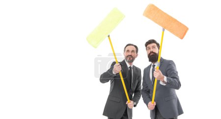 Téléchargez les photos : Cleaning service concept. Cover our tracks before someone find out financial fraud. Clear reputation. Bearded men formal suits hold mops. Big cleaning day. Cleaning business. Household duties. - en image libre de droit