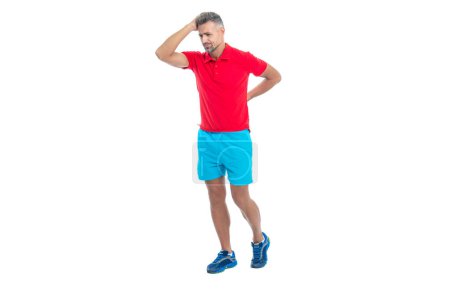 Photo for Sport man massages his lower back to alleviate discomfort of backache. sport man aching back muscles with backache tension. sport man feel the pain of backache. sport man suffering from backache. - Royalty Free Image