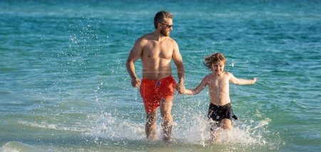 Father son kid bonding relationship. daddy and son running in sea beach. Father son child bonding enjoying summer vacation. have fun together. Special moments between daddy and son at sea.