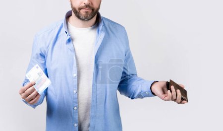 Photo for Cropped view of moneyless man with wallet at hand. photo of moneyless man with wallet. moneyless man with wallet isolated on studio background. moneyless man with wallet in studio. - Royalty Free Image