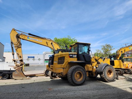 Photo for New York City, USA - May 07, 2023: caterpillar cat excavator or digger vehicle, side view. - Royalty Free Image