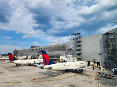 Photo for New York City, USA - May 12, 2023: delta airlines plane in laguarda airport terminal before flight. - Royalty Free Image