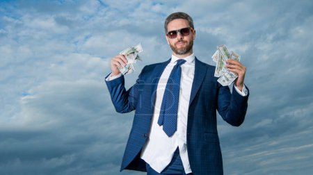 Photo for Riches of man with money on sky background with copy space. riches of man with money outdoor. riches of man with money in suit. riches photo of man with money. - Royalty Free Image