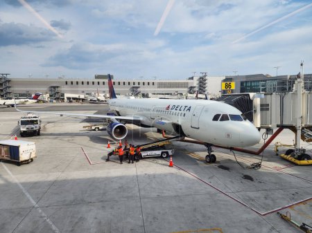 Photo for New York City, USA - May 12, 2023: delta airlines plane airplane in laguarda airport terminal before flight. - Royalty Free Image
