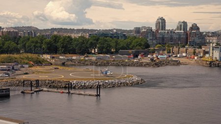 Photo for Victoria, Canada - June 28, 2019: helicopter landing at area of heliport. - Royalty Free Image