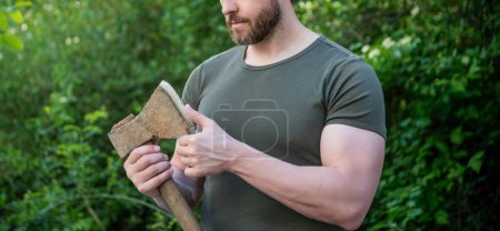 Photo for Man with ax outdoor. cropped photo of man with ax. man with ax. man with ax wearing shirt. - Royalty Free Image