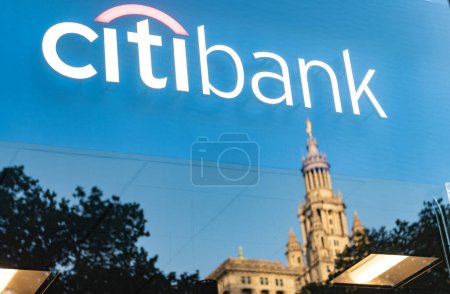 New York City, USA - May 12, 2023: Citibank logo with Manhattan Municipal Building in the back.