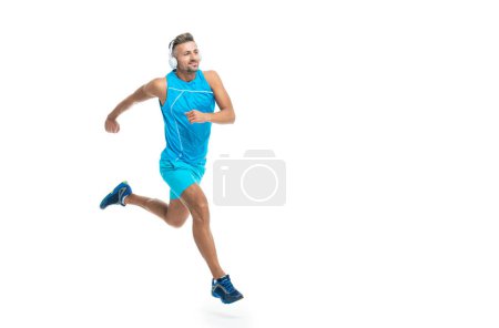 Photo for The jogger ran at sport training isolated on white, banner. In a morning sport workout jogger run in studio. The jogger stretched legs before running. sport jogger listen to music in headphones. - Royalty Free Image