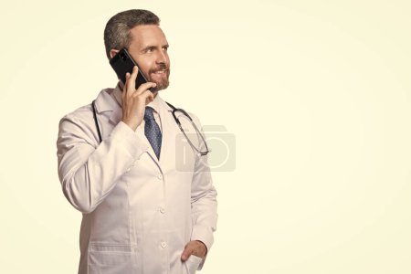 Photo for Physician online isolated on white, copy space. physician online in studio. physician online on background. photo of physician online with phone. - Royalty Free Image