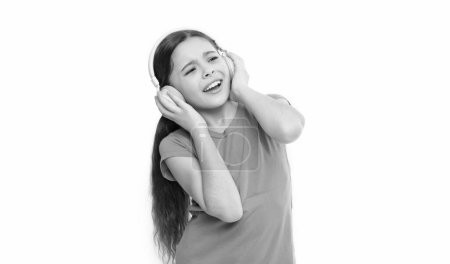 Foto de Niños usan auriculares a diario. Niña pequeña escucha música. niño disfrutando del sonido por ahora. Los auriculares calman a los niños. Ventajas de usar auriculares. niño interesado en la socialización. - Imagen libre de derechos