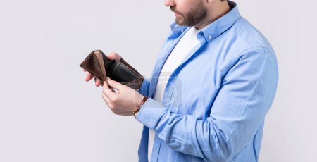 Photo for Cropped photo of bankrupt man with wallet. bankrupt man with wallet isolated on studio background. bankrupt man with wallet in studio. bankrupt man with wallet at hand. - Royalty Free Image