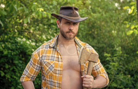 Photo for Lumberjack with axe wearing unbuttoned checkered shirt. lumberjack with axe outdoor. photo of lumberjack with axe. lumberjack with axe. - Royalty Free Image