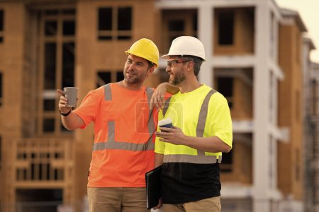 Photo for Two engineer men at construction site wearing hardhat outdoor. - Royalty Free Image