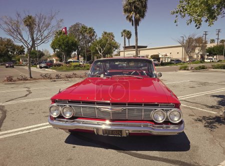 Photo for Los Angeles, California USA - March 28, 2021: red chevrolet impala retro car front view. - Royalty Free Image