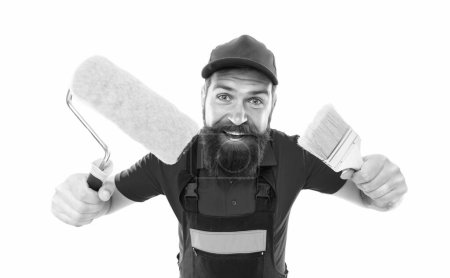 Photo for Happy decorator with paintroller and paint brush. decorator with paintroller in uniform. bearded decorator with paintroller in studio. decorator with paintroller isolated on white background. - Royalty Free Image