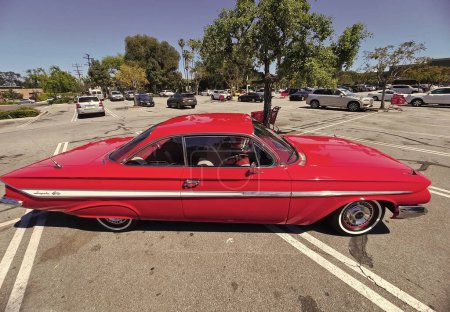 Photo for Los Angeles, California USA - March 28, 2021: red chevrolet impala retro car up side view. - Royalty Free Image