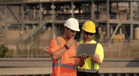 Photo for Pondering supervisor men with construction project. supervisor men with construction project. supervisor men discussing construction project outdoor. supervisor men have construction project on laptop - Royalty Free Image