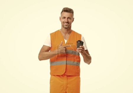 Photo for Photo of man worker pointing finger on coffee at break wear orange waistcoat. man worker at break isolated on white. man worker at break in studio. man worker at break on background. - Royalty Free Image