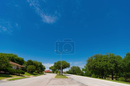 Photo for Road way with power lines. travelling by road way. road way with no cars. empty road with destination in horizon. calm neighborhood. - Royalty Free Image