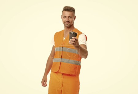Photo for Smiling man worker in white studio. man worker on background. photo of man worker wearing reflective vest. man worker with coffee isolated on white. - Royalty Free Image