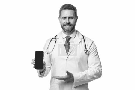 Photo for Medical application. happy man doctor presenting medical phone application. emedicine in your phone. - Royalty Free Image