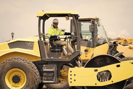 Photo for Busy worker man on construction equipment. construction man worker driving heavy machinery for roadwork. man worker at construction machinery outdoor. man construction worker used vibratory roller. - Royalty Free Image
