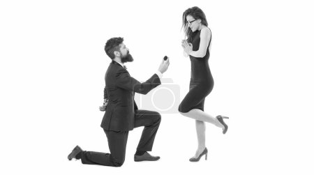 Photo for Pure feelings. Will you marry me. i said yes. happy valentines day. tuxedo couple formal event. couple in love celebrate engagement. wedding party time. man on one knee making marriage proposal. - Royalty Free Image