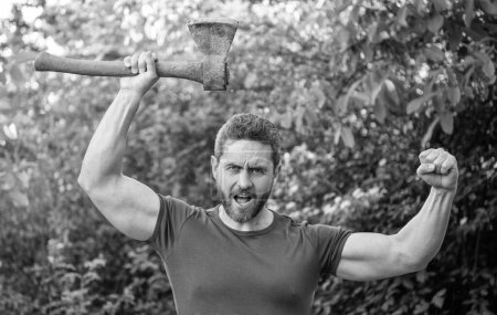 Photo for Aggressive man with axe wearing shirt. aggressive man with axe outdoor. photo of aggressive man with axe. aggressive man with axe. - Royalty Free Image
