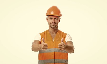 Photo for Man engineer in white studio, thumb up. man engineer on background. photo of man engineer wearing reflective vest. man engineer isolated on white. - Royalty Free Image