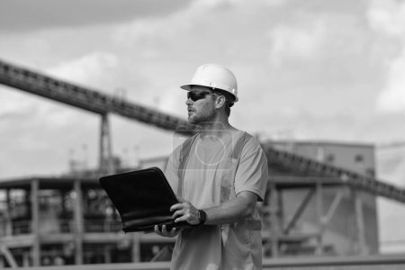 Photo for Supervisor man with construction project. supervisor man discussing construction project outdoor. supervisor man have construction project on laptop. photo of supervisor man with construction project. - Royalty Free Image
