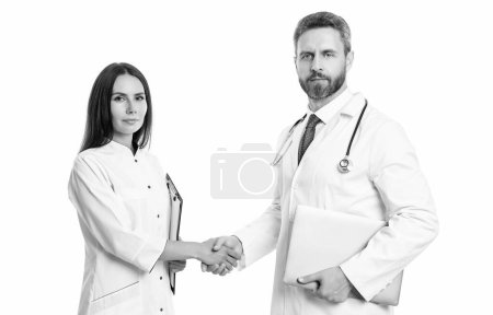Photo for Photo of doctor handshaking internist wear white coat. internist and doctor with laptop and anamnesis. doctor and internist isolated on white background. doctor with internist in studio. - Royalty Free Image