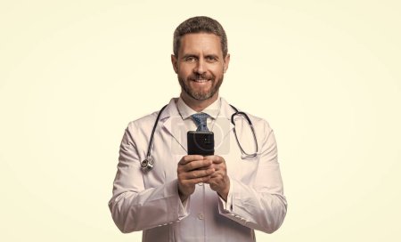 Photo for Happy physician online isolated on white. physician online in studio. physician online on background. photo of physician online with phone. - Royalty Free Image