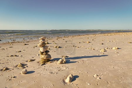 Photo for Zen pebble at beach. nature balance concept. zen like summer. stone pyramid at sea. copy space banner. life equilibrium. balance and harmony in life. harmony and balance. - Royalty Free Image
