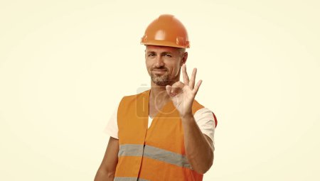Photo for Man engineer on background, ok. photo of man engineer wearing reflective vest. man engineer isolated on white. man engineer in white studio. - Royalty Free Image