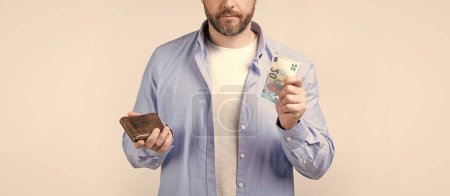 Photo for Cropped photo of moneyless man with wallet. moneyless man with wallet isolated on studio background. moneyless man with wallet in studio. moneyless man with wallet at hand. - Royalty Free Image