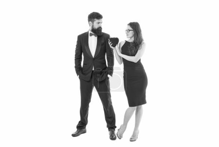 Téléchargez les photos : Just married man and woman. valentines day. bearded man tuxedo and girl glasses. formal couple in love hold heart. engagement. elegant couple formal event. love and romance. special occasion. - en image libre de droit
