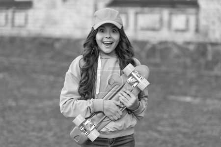 Photo for Amazed teen girl skater with skateboard outdoor. girl with penny board. hipster girl with longboard skate. - Royalty Free Image