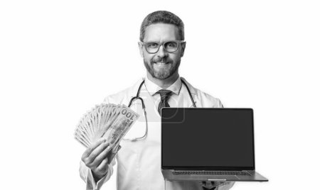 Photo for Happy doctor offering ehealth insurance in studio. doctor presenting ehealth insurance. photo of ehealth insurance and doctor man with money. doctor promoting ehealth insurance isolated on white. - Royalty Free Image