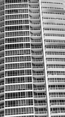 Architectural detail of modern skyscraper residential architecture with windows and balconies in south beach, usa.