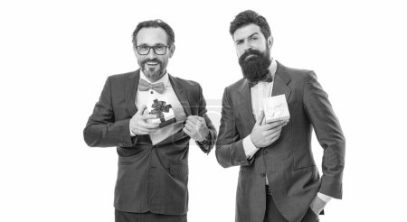 success and reward. esthete. business partners on meeting isolated on white. businessmen in formal suit on party. bearded men hold valentines present. happy birthday shopping. formal men with beard.