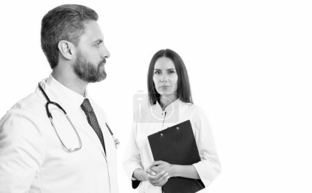 Photo for Nurse and doctor with laptop and anamnesis, selective focus. doctor and nurse isolated on white background. doctor with nurse in studio. photo of doctor and nurse wear white coat. - Royalty Free Image