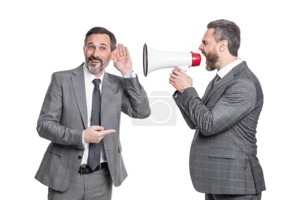 businessmen ignore shouting pointing on loudspeaker. two businessmen ignore shouting in loudspeaker. businessmen ignore shouting in loudspeaker isolated on white. businessmen ignore in loudspeaker