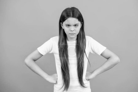 angry teen girl in studio. angry teen girl on background. photo of angry teen girl. angry teen girl isolated on grey.