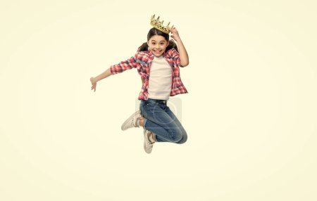 childhood of girl in crown in studio. childhood of girl in crown on background. photo of girl in crown, childhood concept. childhood of girl in crown jump isolated on white.