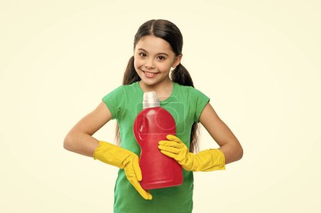 photo of girl with laundry detergent, presenting. girl with laundry detergent isolated on white. girl with laundry detergent in studio. girl with laundry detergent on background.