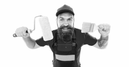 Photo for Glad decorator with paintroller isolated on white background. decorator with paintroller and paint brush. decorator with paintroller in uniform. bearded decorator with paintroller in studio. - Royalty Free Image