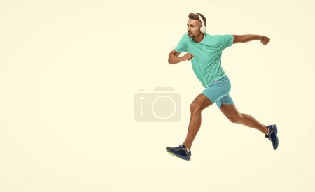 Man sportsman running for exercise in studio with copy space banner. sportsman jogger running. The sportsman running at full speed towards the finish line. sportsman runner running isolated on white.