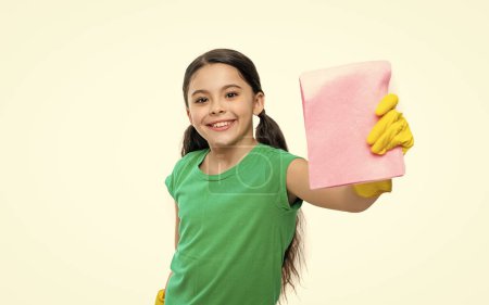 photo of girl cleaner do chores with duster, selective focus. girl cleaner do chores isolated on white. girl cleaner do chores in studio. girl cleaner do chores on background.