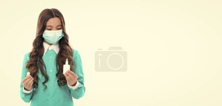girl look at nasal spray. medicine girl and nasal spray, copy space. medicine girl in mask with nasal drops isolated on white. medicine girl keep health holding nasal drops. medicine and health.