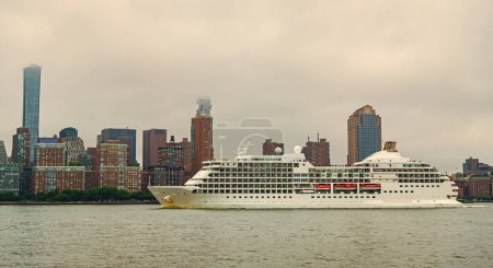 Cruise ship sailing next Manhattan in New York. Skyline of New York Manhattan cruising on the Hudson River cruise liner . Vacation on cruise liner